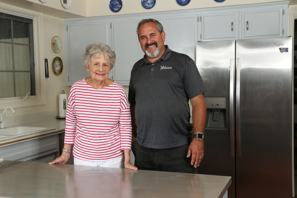 franchisee giving woman a new kitchen N-Hance franchise cost gave this man a chance to help a woman with her kitchen