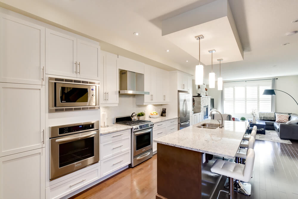 N-Hance refinished white kitchen with cylinder lights