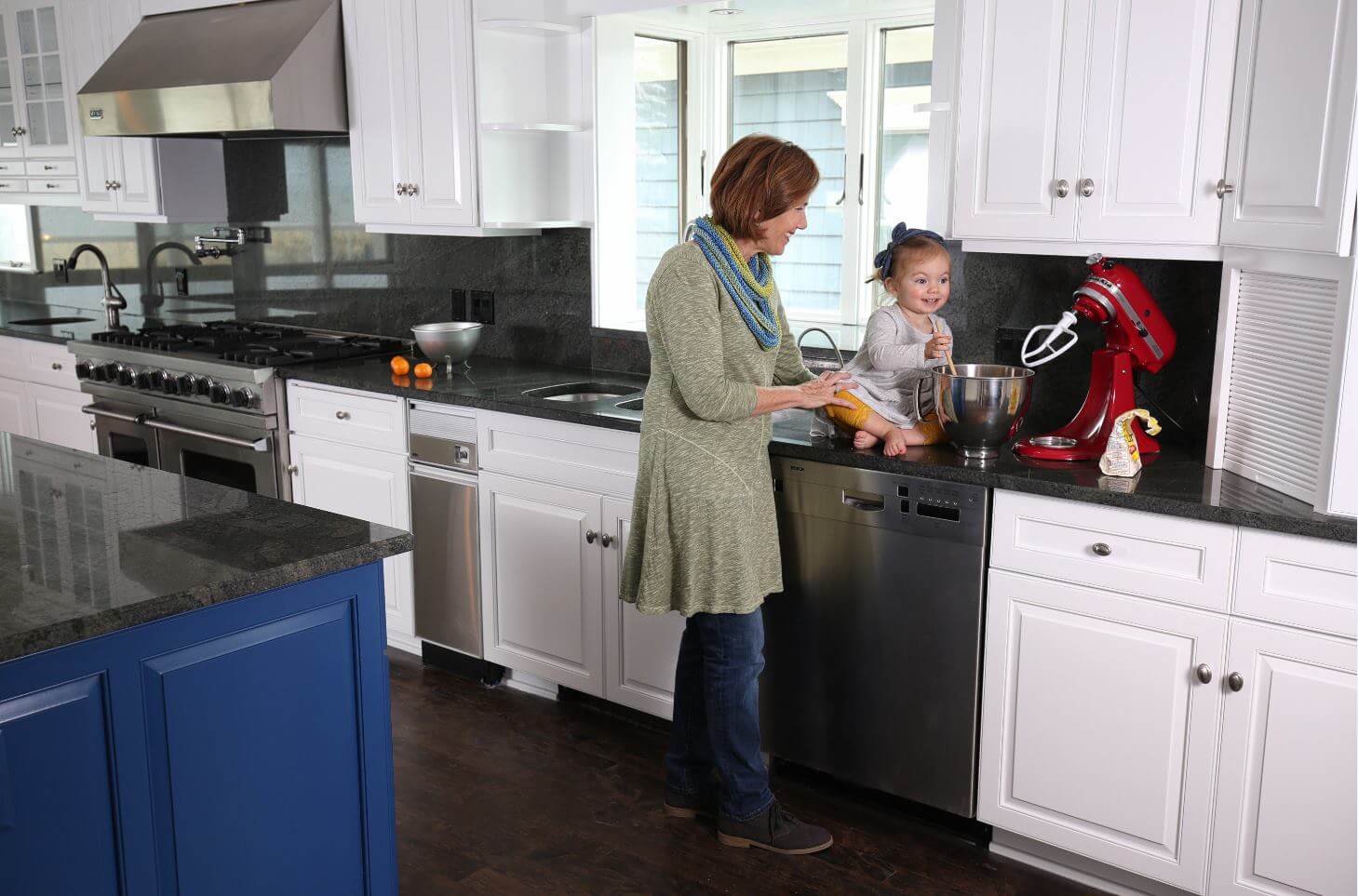 mother and baby in kitchen on counter