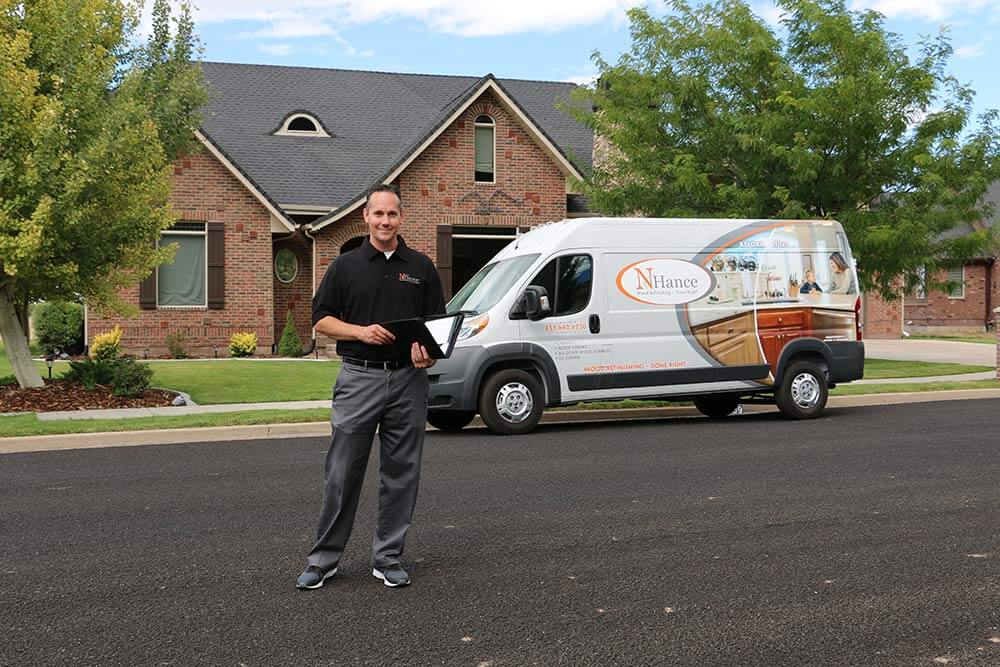 N-Hance franchise owner stands with N-Hance van